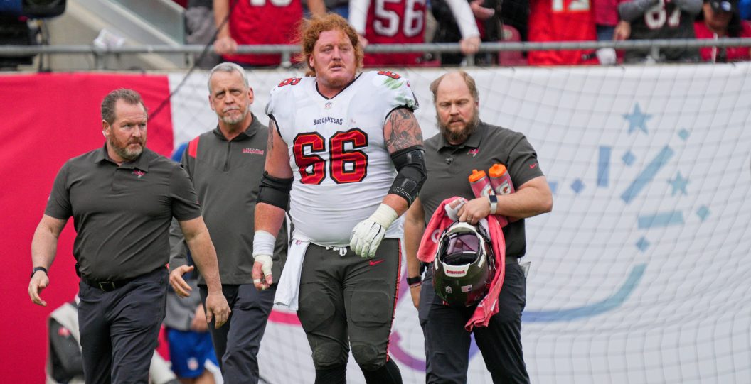 TAMPA, FL - JANUARY 16: Tampa Bay Buccaneers center Ryan Jensen (66) is helped off the field during the game between the Philadelphia Eagles and the Tampa Bay Buccaneers on January 16, 2022 at Raymond James Stadium in Tampa, FL.