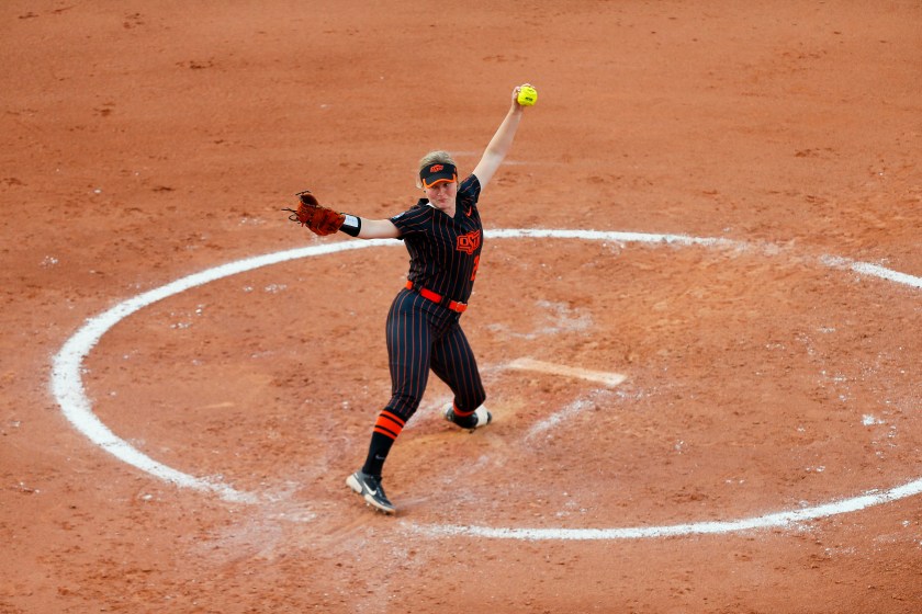 OKLAHOMA CITY, OK - JUNE 4:  Starting pitcher Kelly Maxwell #28 of the Oklahoma State Cowboys throws against the Florida Gators during the NCAA Women's College World Series at the USA Softball Hall of Fame Complex on June 4, 2022 in Oklahoma City, Oklahoma.  Oklahoma State won 2-0.  