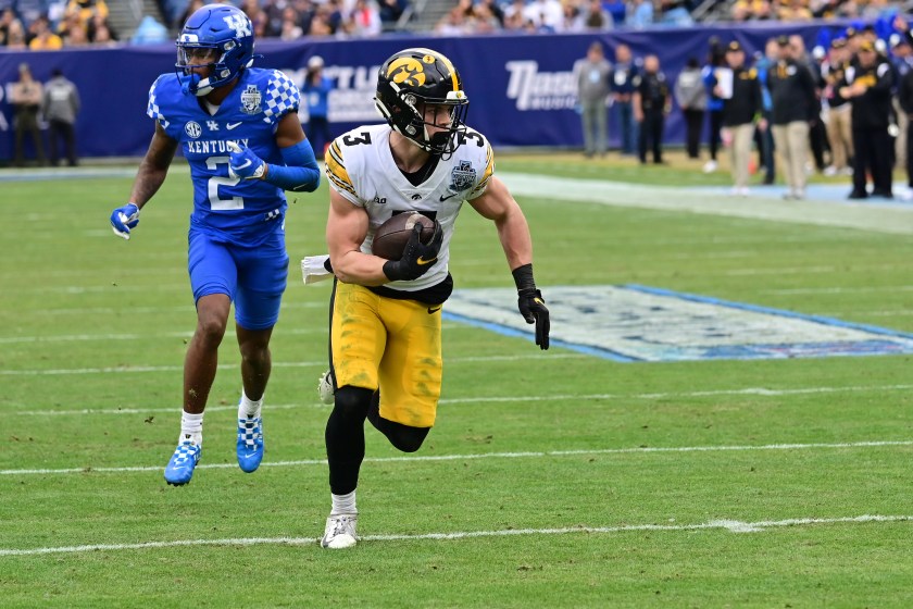 NASHVILLE, TN - DECEMBER 31: Iowa left cornerback Cooper DeJean (3) returns a pass interception 14 yards for a touchdown during the TransPerfect Music City Bowl game between the Kentucky Wildcats and the Iowa Hawkeyes on December 31, 2022, at Nissan Stadium in Nashville, TN 