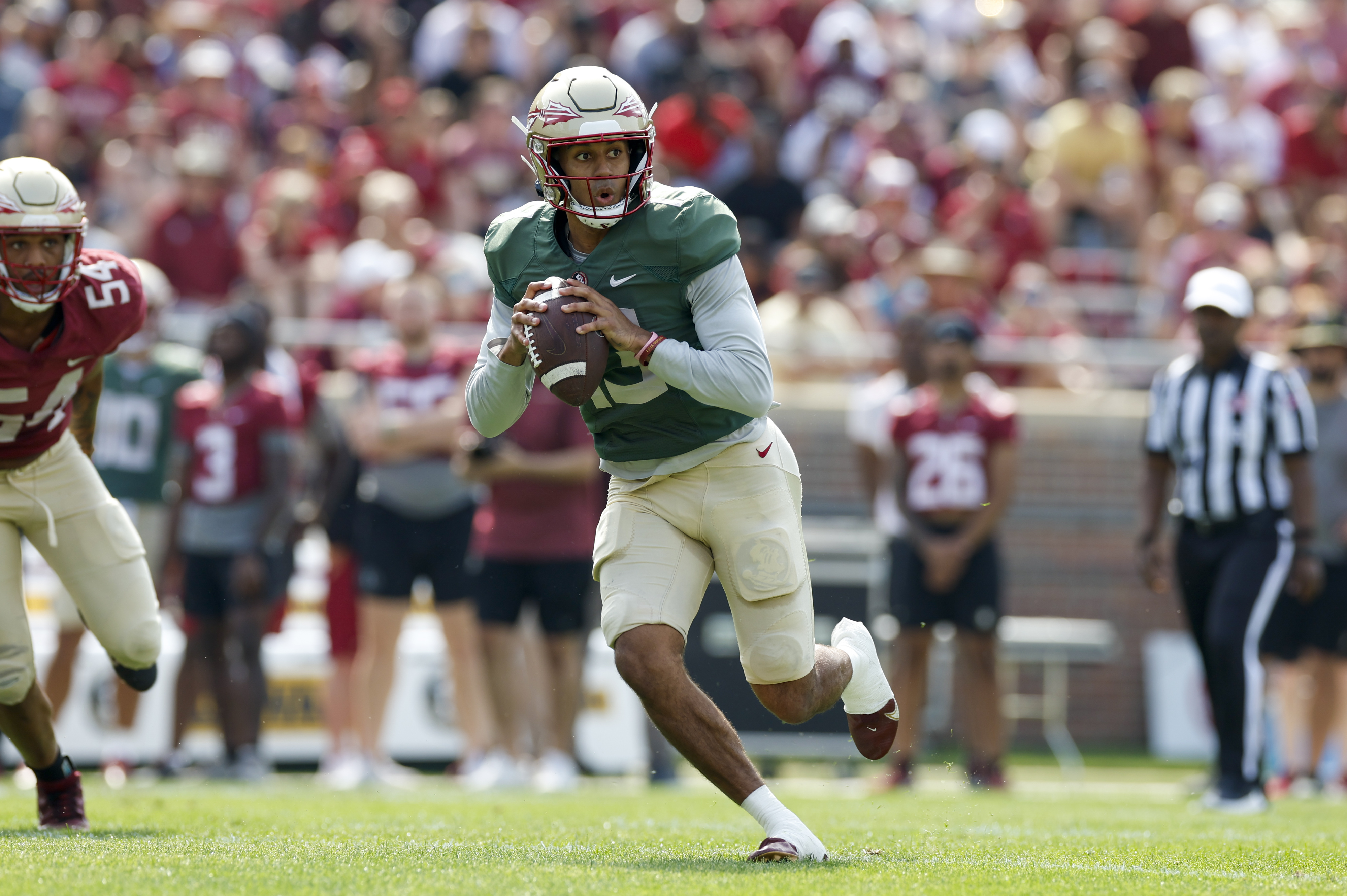 TALLAHASSEE, FL - APRIL 15: Florida State Seminoles quarterback Jordan Travis (13) runs with the ball during the Florida State Garnet & Gold Spring Showcase on April 15, 2023 at Bobby Bowden Field at Doak Campbell Stadium in Tallahassee, Fl. 