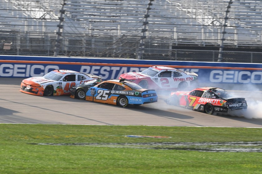 NASCAR drivers collide during a race.