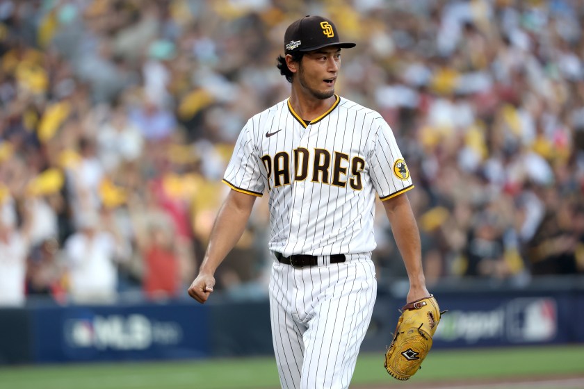 SAN DIEGO, CALIFORNIA - OCTOBER 18: Yu Darvish #11 of the San Diego Padres reacts after the top of the first inning against the Philadelphia Phillies in game one of the National League Championship Series at PETCO Park on October 18, 2022 in San Diego, California. 