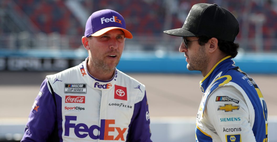 AVONDALE, ARIZONA - NOVEMBER 05: Chase Elliott, driver of the #9 NAPA Auto Parts Chevrolet, (R) and Denny Hamlin, driver of the #11 FedEx Express Toyota, talk on the grid during qualifying for the NASCAR Cup Series Championship at Phoenix Raceway on November 05, 2022 in Avondale, Arizona.
