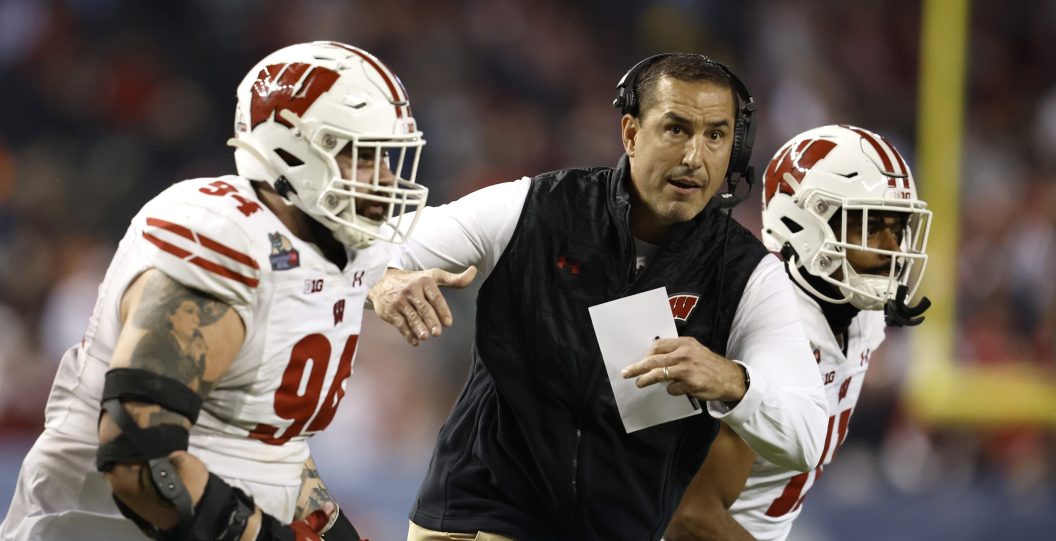 PHOENIX, ARIZONA - DECEMBER 27: Head coach Luke Fickell of the Wisconsin Badgers runs onto the field to call a time out during the second half of the Guaranteed Rate Bowl against the Oklahoma State Cowboys at Chase Field on December 27, 2022 in Phoenix, Arizona.