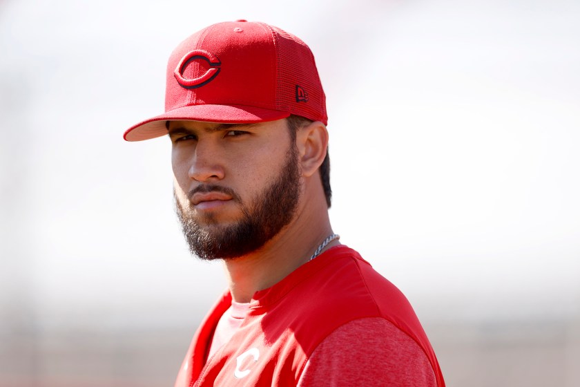 Reds rookie pitcher Lyon Richardson looks at the camera while practicing.