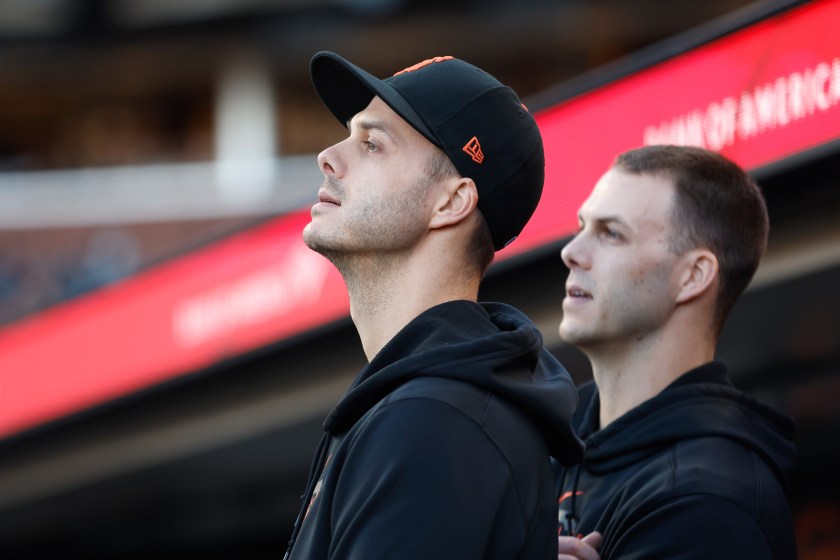 SAN FRANCISCO, CALIFORNIA - JUNE 19: Tyler Rogers #71 and Taylor Rogers #33 of the San Francisco Giants look on from the dugout during the game against the San Diego Padres at Oracle Park on June 19, 2023 in San Francisco, California. 