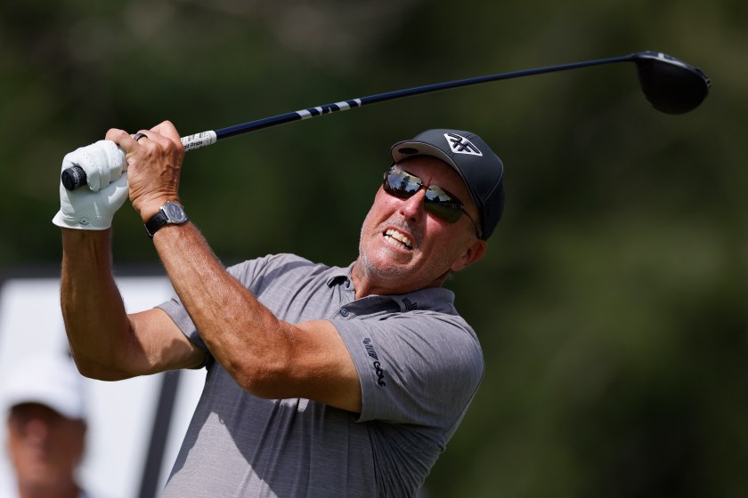 Phil Mickelson swings during a LIV event.