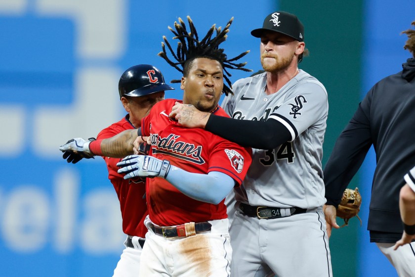 Guardians star Jose Ramirez is held back by a White Sox player
