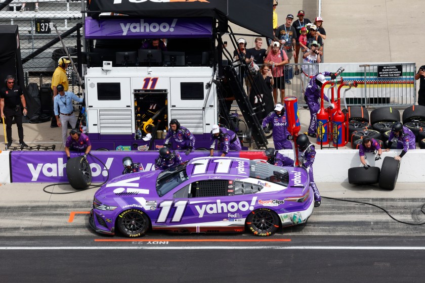 INDIANAPOLIS, IN - AUGUST 13: NASCAR driver Denny Hamlin (11) does a pit stop during the NASCAR Cup Series Verizon 200 at the Brickyard on August 13, 2023, at the Indianapolis Motor Speedway Road Course in Indianapolis, Indiana. 