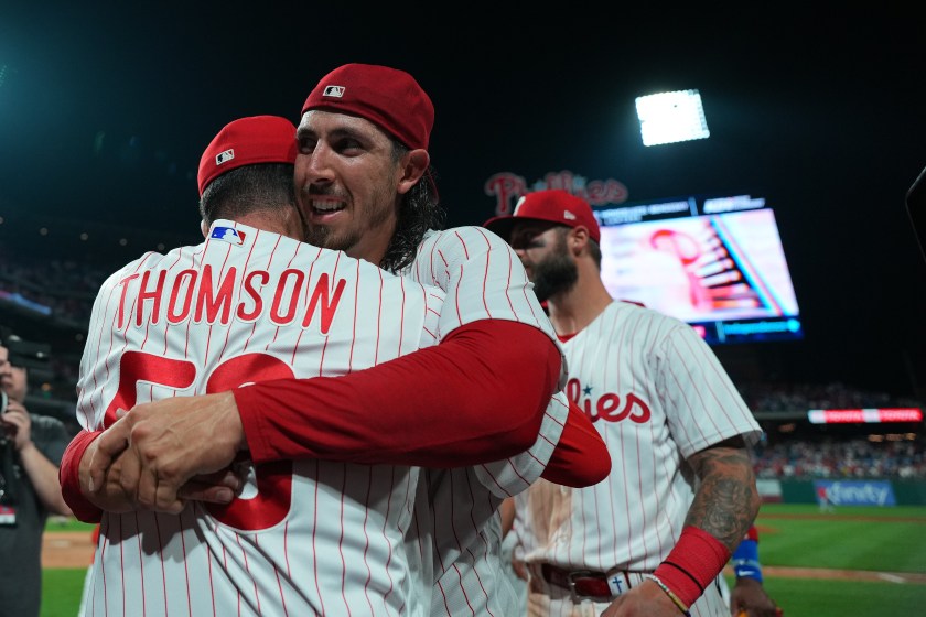 PHILADELPHIA, PENNSYLVANIA - AUGUST 9: Michael Lorenzen #22 of the Philadelphia Phillies hugs manager Rob Thomson #59 after throwing a no-hitter against the Washington Nationals at Citizens Bank Park on August 9, 2023 in Philadelphia, Pennsylvania. The Phillies defeated the Nationals 7-0. 