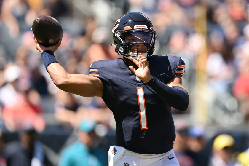 CHICAGO, ILLINOIS - AUGUST 12: Justin Fields #1 of the Chicago Bears passes in the first quarter against the Tennessee Titans during a preseason game at Soldier Field on August 12, 2023 in Chicago, Illinois. 