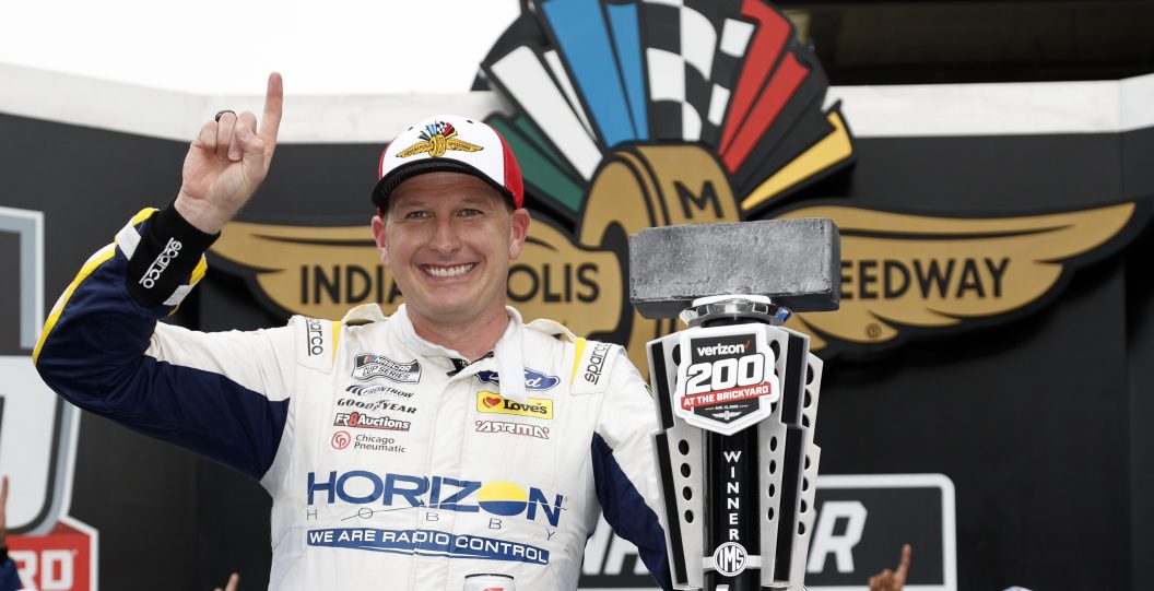 INDIANAPOLIS, INDIANA - AUGUST 13: Michael McDowell, driver of the #34 Horizon Hobby Ford, celebrates in victory lane after winning the NASCAR Cup Series Verizon 200 at the Brickyard at Indianapolis Motor Speedway on August 13, 2023 in Indianapolis, Indiana.