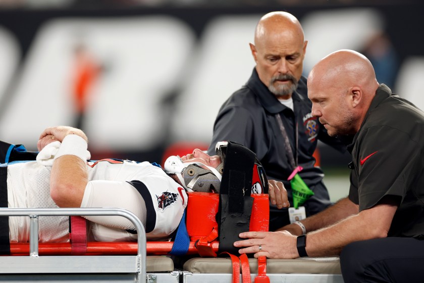 EAST RUTHERFORD, NEW JERSEY - AUGUST 19: John Wolford #11 of the Tampa Bay Buccaneers is taken off the field after an injury during the second half of a preseason game against the New York Jets at MetLife Stadium on August 19, 2023 in East Rutherford, New Jersey. The Buccaneers won 13-6. 