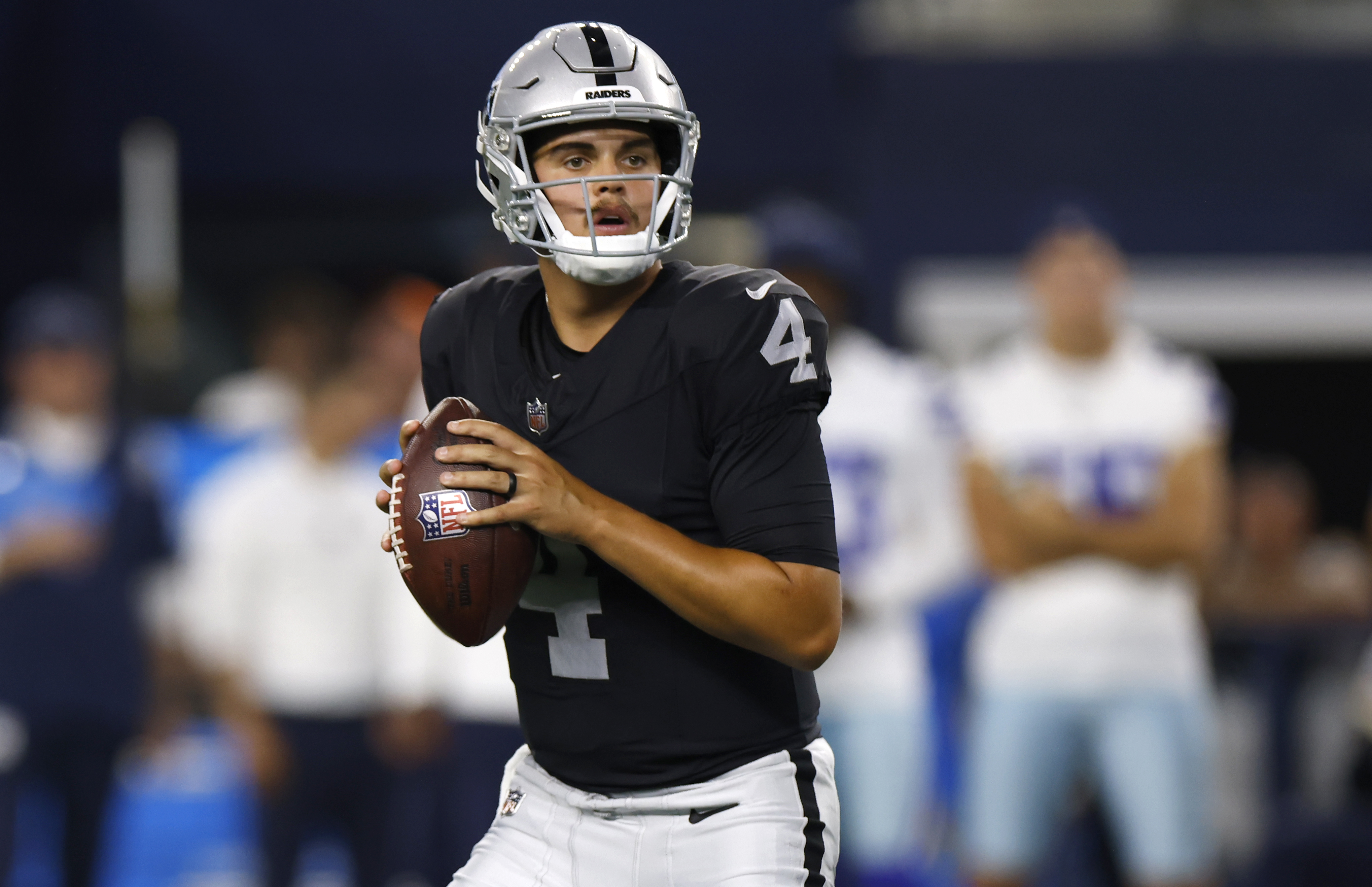 ARLINGTON, TX - AUGUST 26: Aidan O'Connell #4 of the Las Vegas Raiders looks to throw against the Dallas Cowboys during the first half of a preseason game at AT&T Stadium on August 26, 2023 in Arlington, Texas. 