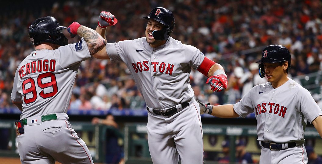 HOUSTON, TEXAS - AUGUST 21: Adam Duvall #18 of the Boston Red Sox celebrates his three-run home run with Alex Verdugo #99 and Masataka Yoshida #7 in the first inning against the Houston Astros at Minute Maid Park on August 21, 2023 in Houston, Texas.