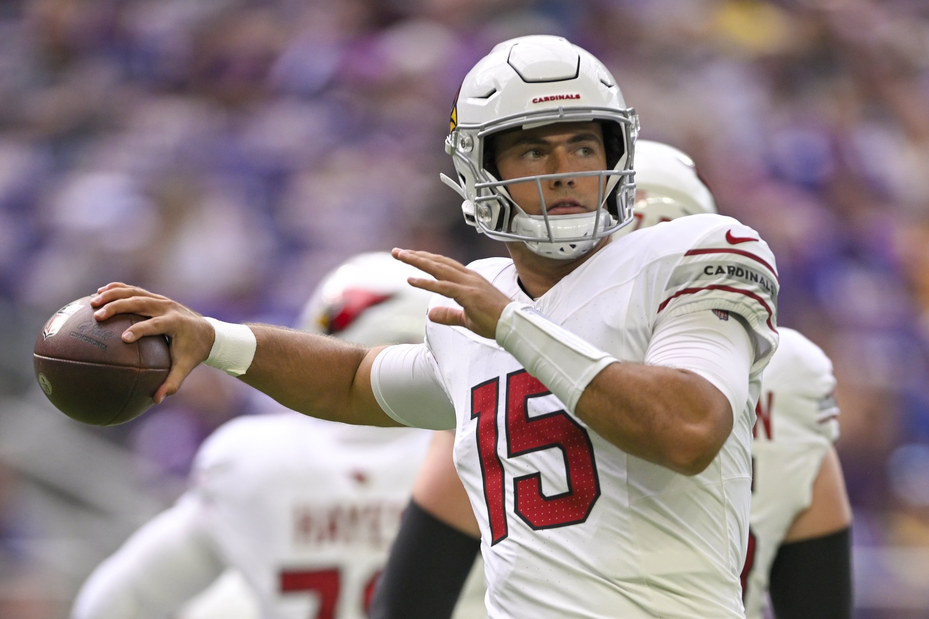 MINNEAPOLIS, MN - AUGUST 26: Arizona Cardinals Quarterback Clayton Tune (15) throws a pass to stay loose during a pre-season NFL game between the Minnesota Vikings and Arizona Cardinals on August 26, 2023, at U.S. Bank Stadium in Minneapolis, MN.