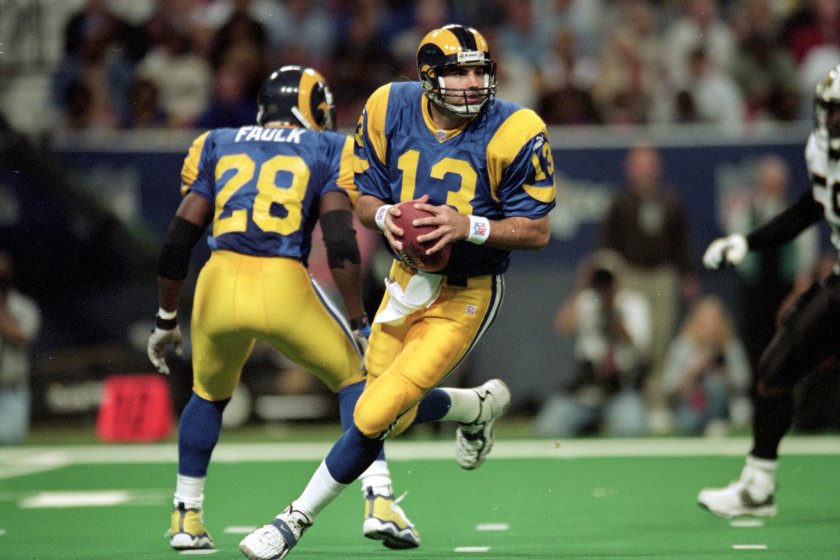 28 Nov 1999: Kurt Warner #13 of the St. Louis Rams runs to pass the ball during a game against the New Orleans Saints at the Trans World Dome in St. Louis, Missouri. The Rams defeated the Saints 43-12. 