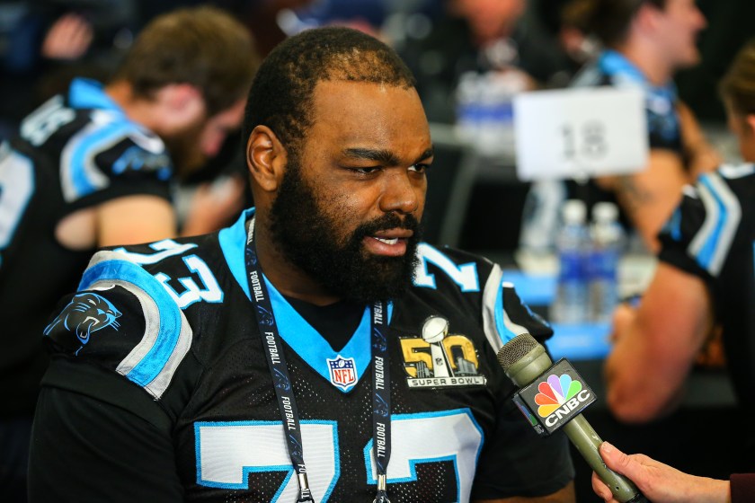 Michael Oher speaks to reporters with the Panthers.