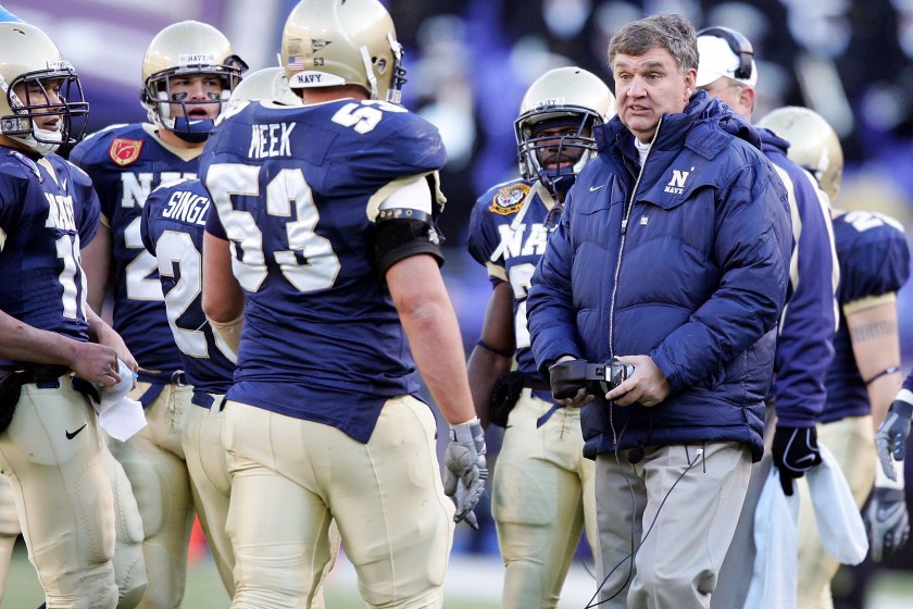 BALTIMORE - DECEMBER 01: Head coach Paul Johnson of the Navy Midshipmen talks to his team during a time out against the Army Black Knights during the 108th Army vs.Navy football game on December 1, 2007 at M&T Bank Stadium in Baltimore, Maryland. 