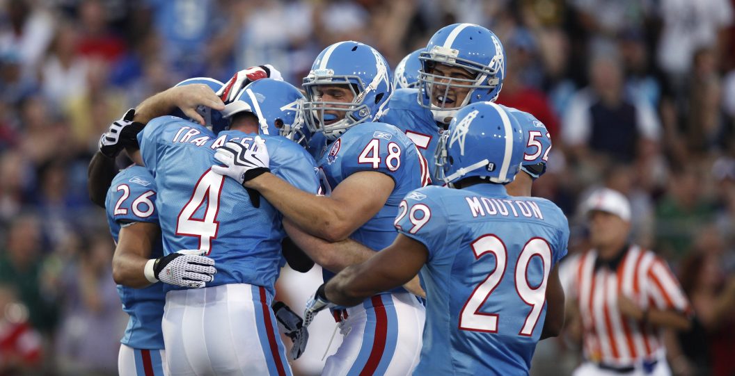 CANTON, OH - AUGUST 9: A.J. Trapasso #4 of the Tennessee Titans celebrates with teammates after running for a touchdown on a fake punt against the Buffalo Bills during the Pro Football Hall of Fame Game at Fawcett Stadium on August 9, 2009 in Canton, Ohio.