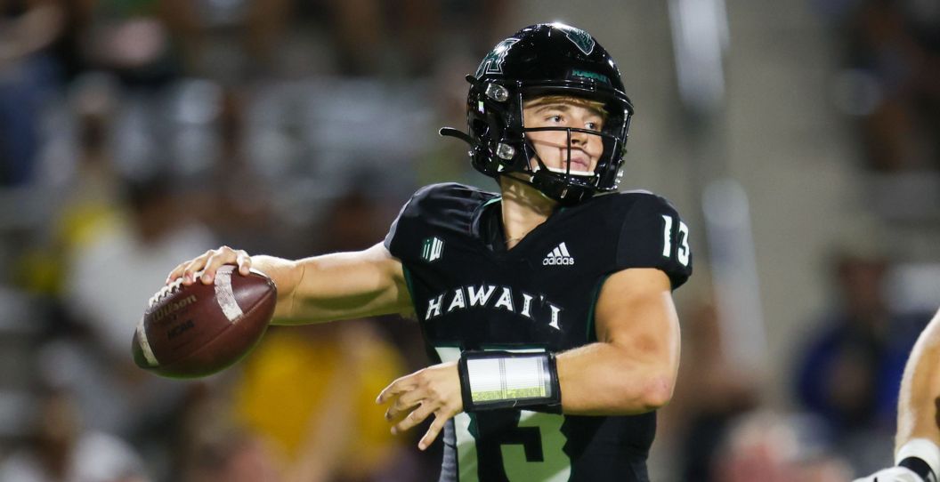 Hawaii's quarterback throws a pass.