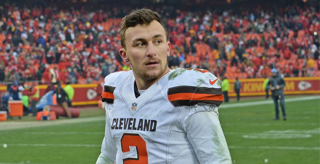 Johnny Manziel walks off the field with the Browns.