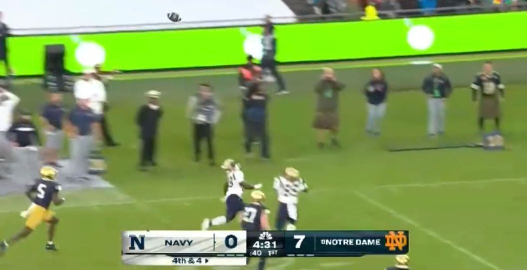 Two Navy receivers collide on a play.