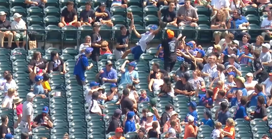 New York Mets fan makes diving catch.