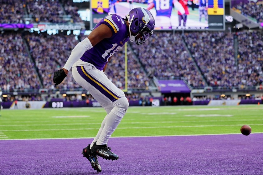 MINNEAPOLIS, MINNESOTA - DECEMBER 04: Justin Jefferson #18 of the Minnesota Vikings celebrates after scoring a touchdown during the fourth quarter against the New York Jets at U.S. Bank Stadium on December 04, 2022 in Minneapolis, Minnesota. 