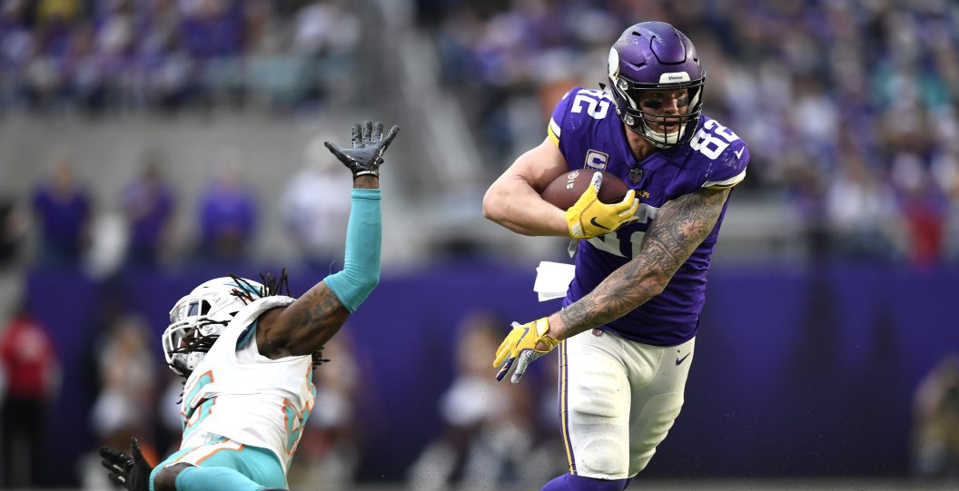 MINNEAPOLIS, MN - DECEMBER 16: Kyle Rudolph #82 of the Minnesota Vikings avoids a tackle by Walt Aikens #35 of the Miami Dolphins in the third quarter of the game at U.S. Bank Stadium on December 16, 2018 in Minneapolis, Minnesota.