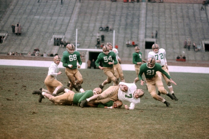 SOUTH BEND, IN - APRIL 16: The Notre Dame alumni team (white) plays against the Notre Dame varsity team (green) during an alumni game on April 16, 1957 at Notre Dame Stadium in South Bend, Indiana. 