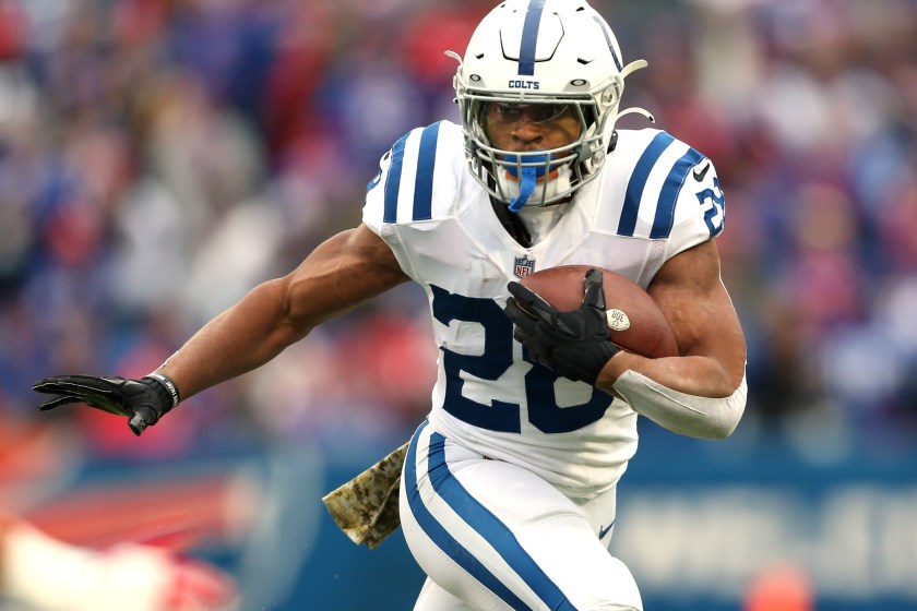 ORCHARD PARK, NEW YORK - NOVEMBER 21: Jonathan Taylor #28 of the Indianapolis Colts runs the ball in the game against the Buffalo Bills during the first quarter at Highmark Stadium on November 21, 2021 in Orchard Park, New York. 