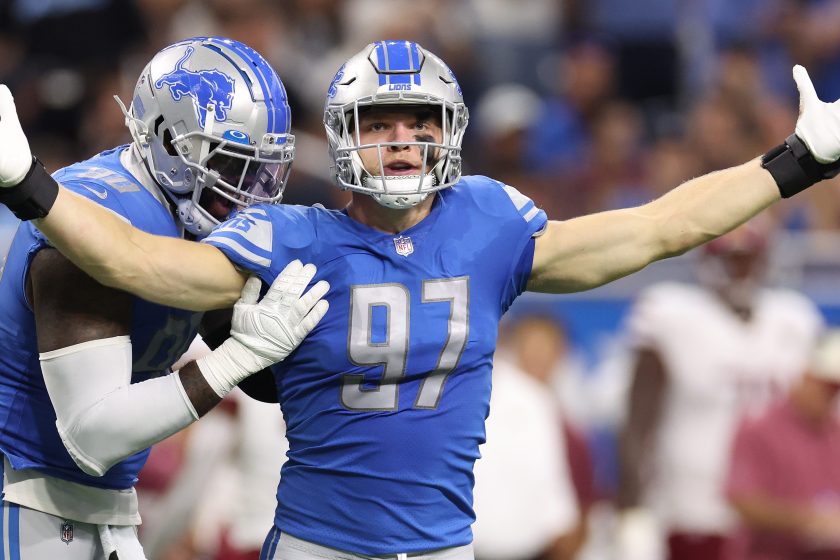 DETROIT, MICHIGAN - SEPTEMBER 18: Aidan Hutchinson #97 of the Detroit Lions is congratulated by Michael Brockers #90 after making his first career sack during the first quarter of the game against the Washington Commanders at Ford Field on September 18, 2022 in Detroit, Michigan.