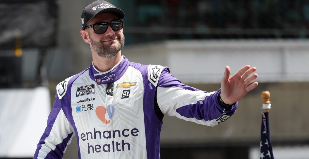 INDIANAPOLIS, INDIANA - AUGUST 13: Shane Van Gisbergen, driver of the #91 Enhance Health Chevrolet, waves to fans during the parade lap prior to the NASCAR Cup Series Verizon 200 at the Brickyard at Indianapolis Motor Speedway on August 13, 2023 in Indianapolis, Indiana.