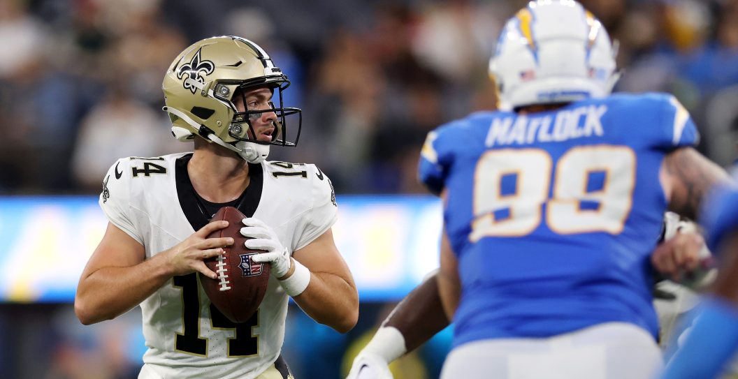 INGLEWOOD, CALIFORNIA - AUGUST 20: Jake Haener #14 of the New Orleans Saints looks to pass the ball during the fourth quarter of the preseason game against the Los Angeles Chargers at SoFi Stadium on August 20, 2023 in Inglewood, California.