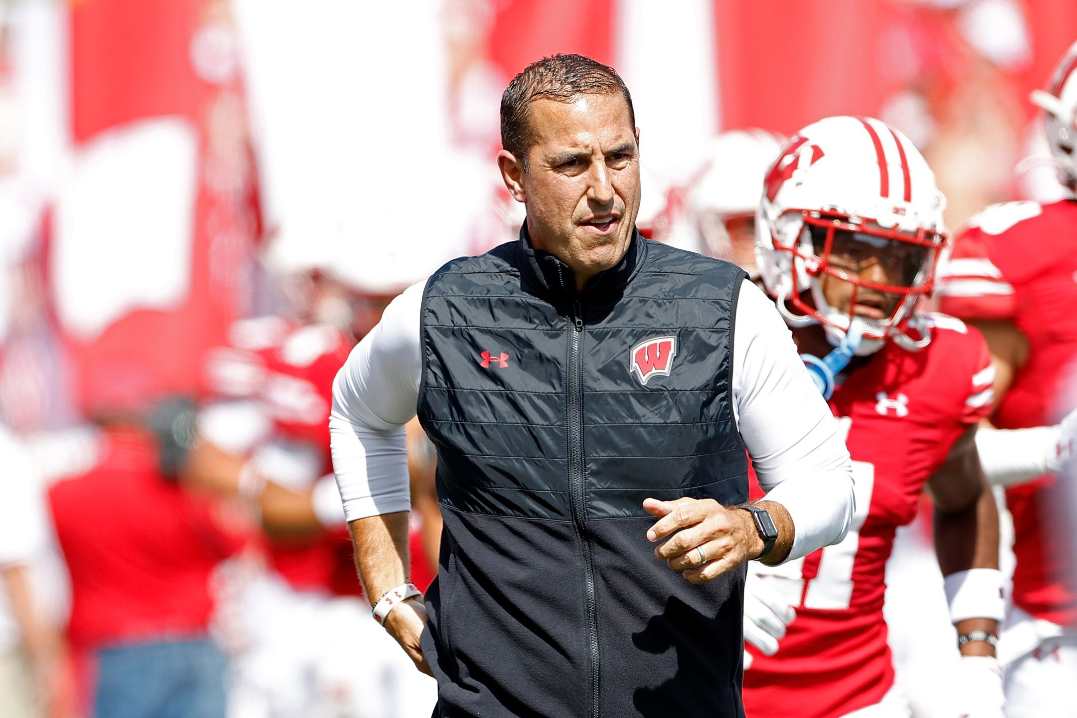 MADISON, WISCONSIN - SEPTEMBER 02: Head coach Luke Fickell of the Wisconsin Badgers runs onto the field at the start of game against the Buffalo Bulls at Camp Randall Stadium on September 02, 2023 in Madison, Wisconsin.