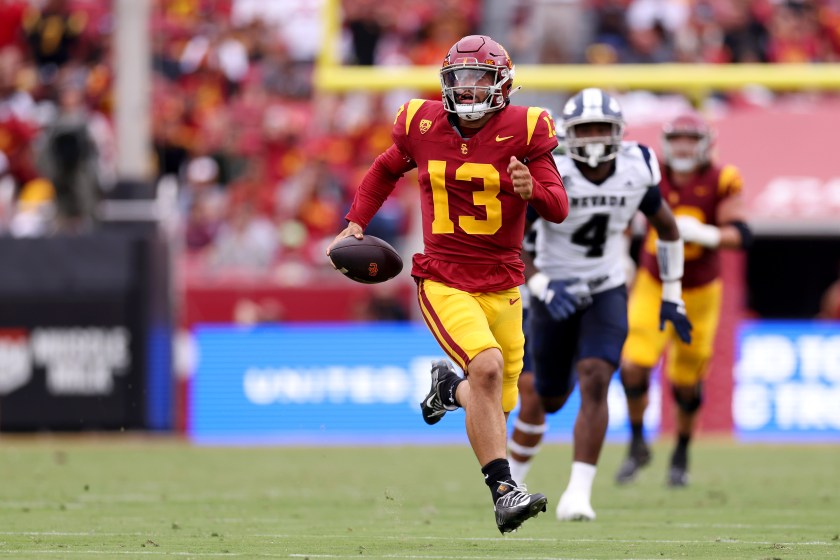 Caleb Williams runs with the ball for USC.