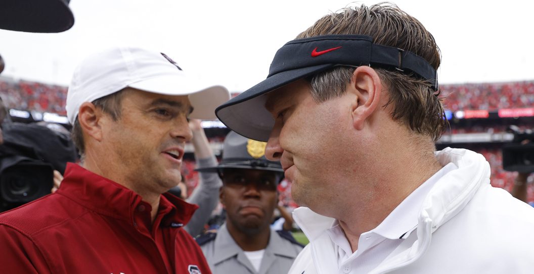 ATHENS, GEORGIA - SEPTEMBER 16: Head coach Kirby Smart of the Georgia Bulldogs (R) shakes hands with head coach Shane Beamer of the South Carolina Gamecocks following the 24-14 Bulldogs victory at Sanford Stadium on September 16, 2023 in Athens, Georgia.