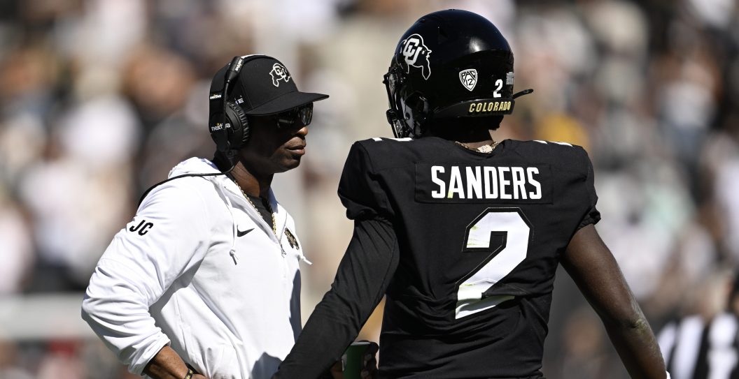 BOULDER, COLORADO - AUGUST 9: Head Coach Deion Sanders talks with his son Colorado Buffaloes quarterback Shedeur Sanders (2) during the first half at Folsom Field on September 9, 2023 in Boulder, Colorado. Head Coach Deion Sanders led the Colorado Buffaloes in a matchup against their long-time rivals, the Nebraska Cornhuskers, during Coach Prime's highly anticipated home debut.