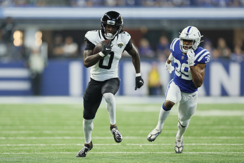 INDIANAPOLIS, INDIANA - SEPTEMBER 10: Calvin Ridley #0 of the Jacksonville Jaguars runs the ball up the field against Darrell Baker Jr. #39 of the Indianapolis Colts in the second quarter of a game at Lucas Oil Stadium on September 10, 2023 in Indianapolis, Indiana. 