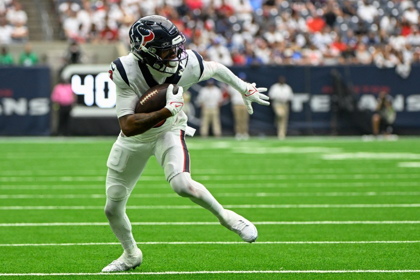 HOUSTON, TX - SEPTEMBER 17: Houston Texans wide receiver Tank Dell (3) looks for running room in the flat after a short reception during the football game between the Indianapolis Colts and Houston Texans at NRG Stadium on September 17, 2023, in Houston, Texas. 