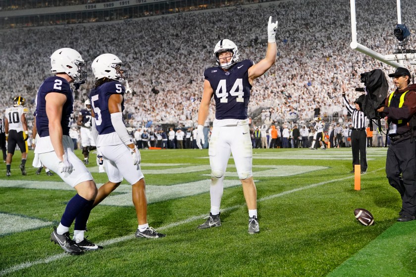 Penn State football players celebrate a touchdown.