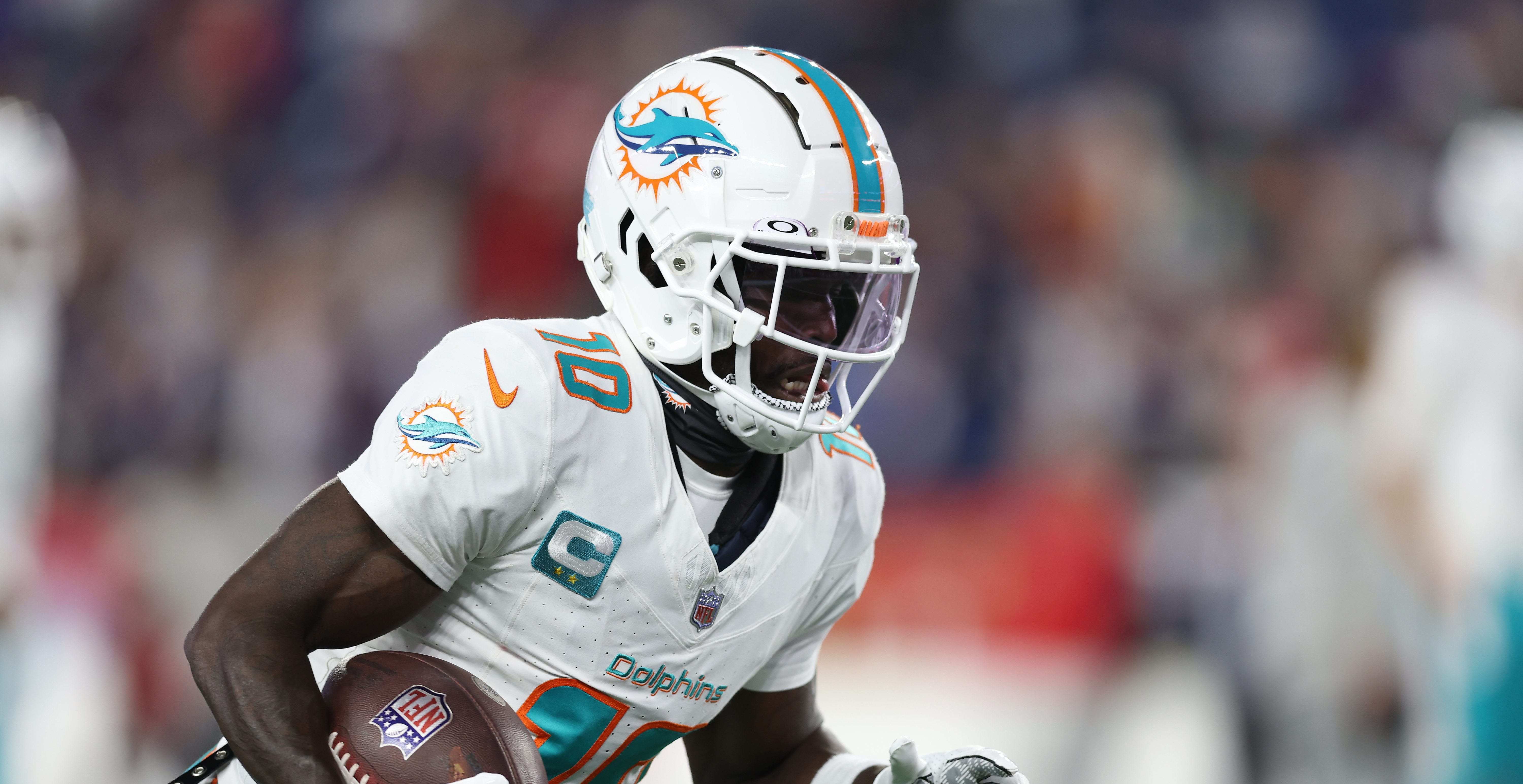 Miami Dolphins wide receiver Tyreek Hill (10) stands on the field