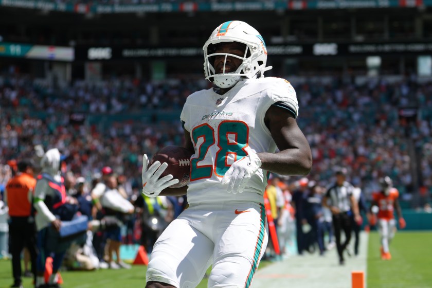 MIAMI GARDENS, FL - SEPTEMBER 24: Miami Dolphins running back De'Von Achane (28) smiles after scoring a rushing touchdown during the game between the Denver Broncos and the Miami Dolphins on Sunday, September 24, 2023 at Hard Rock Stadium, Miami, Fla. 