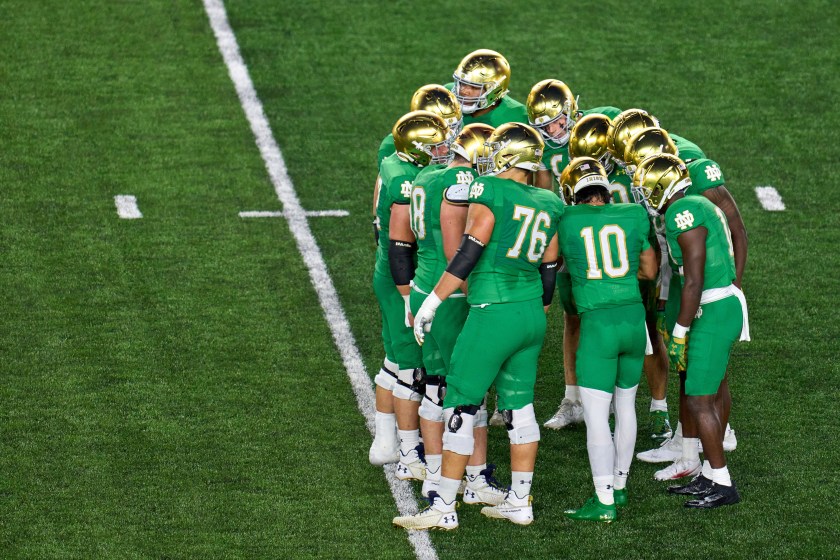 Notre Dame players huddle up.