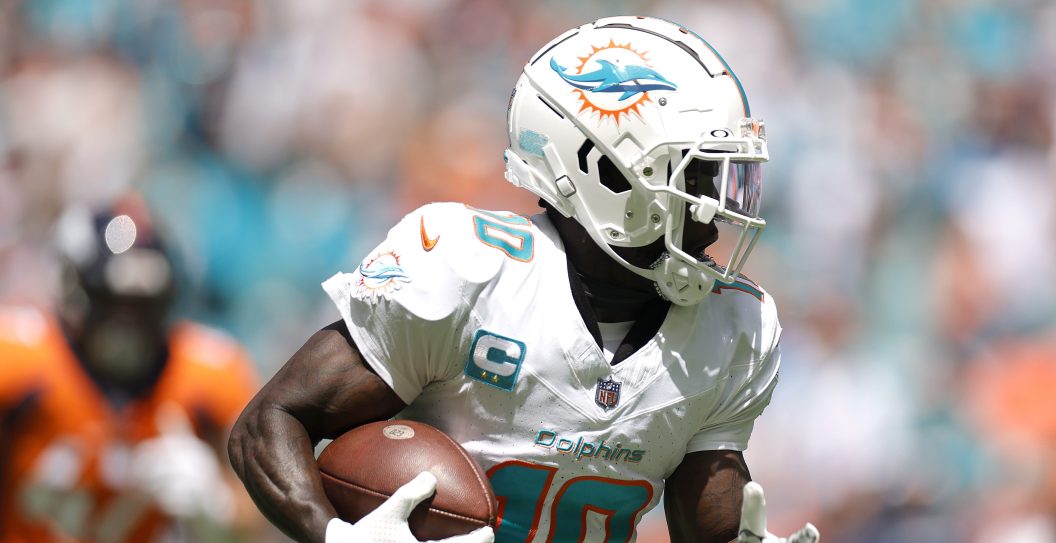 MIAMI GARDENS, FLORIDA - SEPTEMBER 24: Tyreek Hill #10 of the Miami Dolphins scores a touchdown during the first quarter against the Denver Broncos at Hard Rock Stadium on September 24, 2023 in Miami Gardens, Florida.