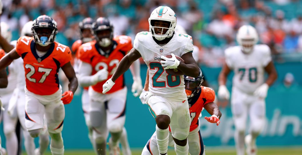 MIAMI GARDENS, FLORIDA - SEPTEMBER 24: De'Von Achane #28 of the Miami Dolphins rushes for a touchdown against the Denver Broncos during the fourth quarter at Hard Rock Stadium on September 24, 2023 in Miami Gardens, Florida.