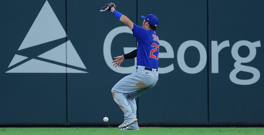 ATLANTA, GEORGIA - SEPTEMBER 26: Seiya Suzuki #27 of the Chicago Cubs makes a fielding error as he fails to catch this fly ball by Sean Murphy #12 of the Atlanta Braves in the eighth inning at Truist Park on September 26, 2023 in Atlanta, Georgia. Matt Olson #28 and Forrest Wall #73 score on the error.