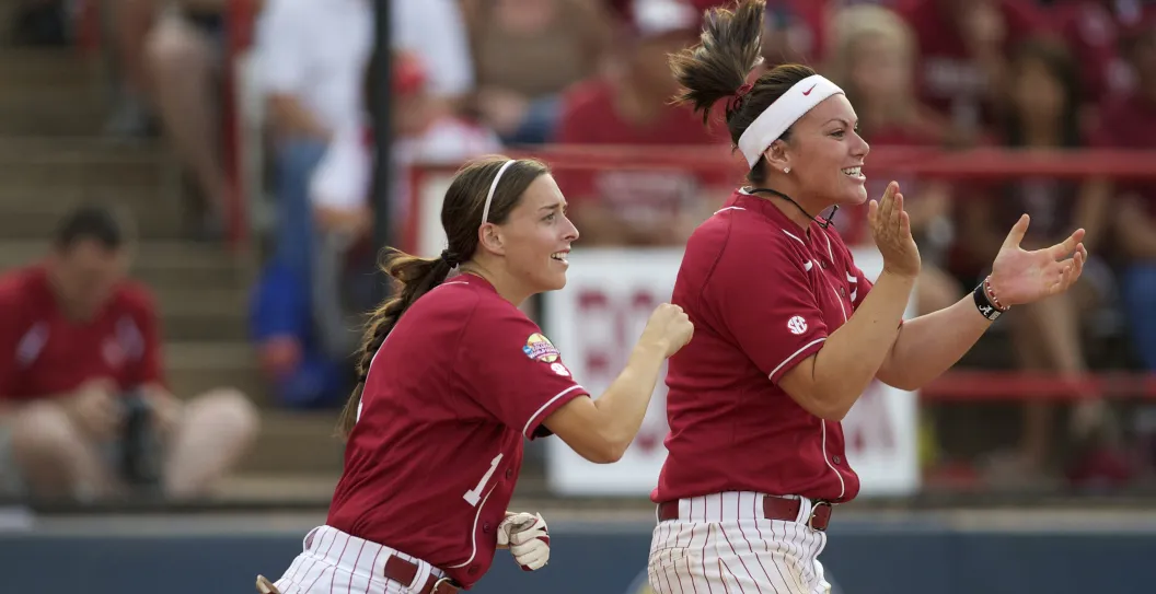 05 JUNE 2012: Kayla Braud (1) and Courtney Conley (9) of the University of Alabama celebrates Jackie Traina's hit against the University of Oklahoma during the Division I Women's Softball Championship held at ASA Hall of Fame Stadium in Oklahoma City, OK. Alabama defeated Oklahoma 8-6 in Game Two of the National Championship.