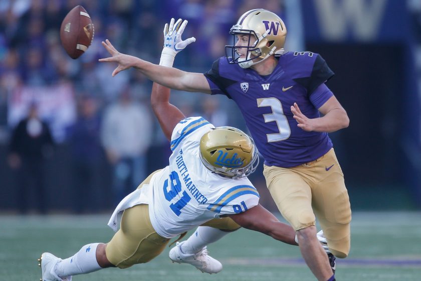 Jake Browning tosses a pass for Washington.